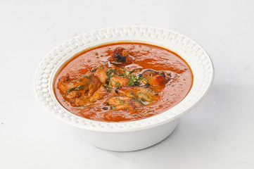Chicken butter masala in white disposable bowl
