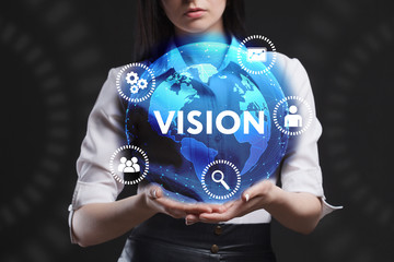 The concept of business, technology, the Internet and the network. A young entrepreneur working on a virtual screen of the future and sees the inscription: Vision