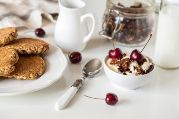 Breakfast with granola, biscuits and berries.