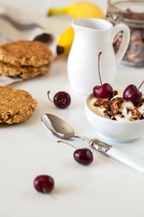Breakfast with granola, biscuits and berries.