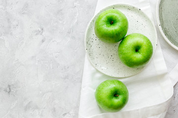 summer food with green apples on stone background top view mock up