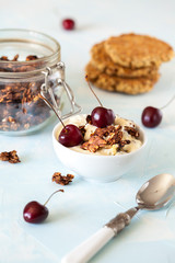 Breakfast with granola, biscuits and berries.