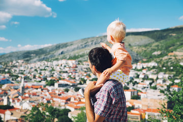 Fototapeta premium Father and son on backgrounds of the Croatian seacoast.
