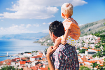 Fototapeta premium Father and son on backgrounds of the Croatian seacoast.