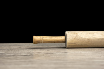 Close up shot of a rolling pin on table
