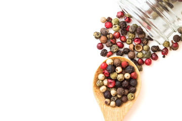 Close up mixed type of the peppercorns in wooden spoon , top view or overhead shot