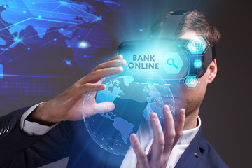 Business, Technology, Internet and network concept. Young businessman working on a virtual screen of the future and sees the inscription: Bank online