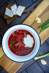 Ukrainian borsch soup and green onion on the table