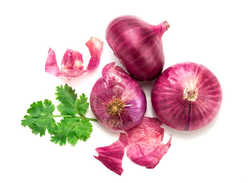 Fresh red onion sliced bulb and onion peel isolated on white background
