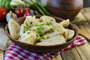 Dumplings with potatoes and cabbage meat - obrazy, fototapety, plakaty
