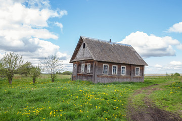 Fototapeta na wymiar Village house near a country road