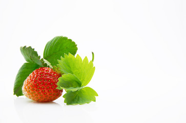 Fresh, ripe, juicy and mouth-watering strawberries with green leaves