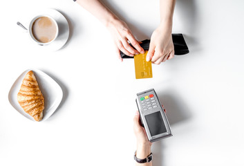 Payment by card for business break on table background top view