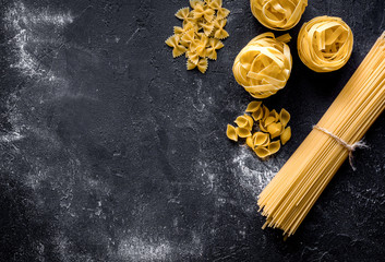 various kinds of paste on dark background top view