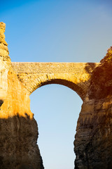 The Praia da Batata bridge at sunset in Lagos, Portugal