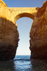 The Praia da Batata bridge at sunset in Lagos, Portugal