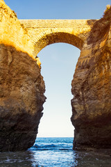 The Praia da Batata bridge at sunset in Lagos, Portugal
