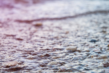 Water rolling in over a rocky beach in Lagos, Portugal