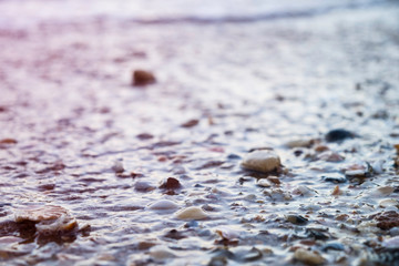 Water rolling in over a rocky beach in Lagos, Portugal