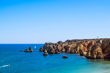 Fototapeta premium Cliffside view of Lagos, Portugal in the late afternoon
