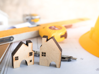 house model in saving plan for residence of people in society, purchasing home for living of dream of community lives. Architecture and construction worker in site