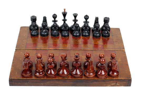 Chess pieces and board on a white background