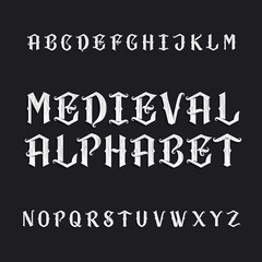 Obraz premium Old medieval alphabet vector font. Distressed type letters on a dark background. Vintage vector typeface for labels, headlines, posters etc.