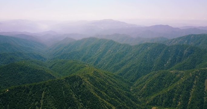 Flight over the cedar valley. landscape of mountains in the mist Cyprus.Drone Point of View Platres in the Troodos. Cyprus. Aerial View. Flying over the mountains 