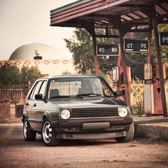 Fototapeta premium Old car on rusty filling station