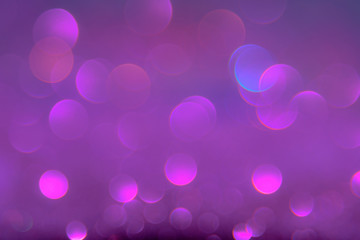 Violet or purple bokeh light is the soft blurred circles of light white and light purple . Winter Christmas and valentine background  wallpaper concept