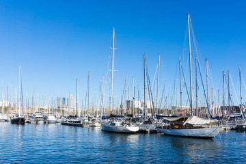 Fototapeta na wymiar Street view of Barcelona harbor with boats, Spain Europe