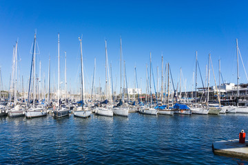 Fototapeta premium Street view of Barcelona harbor with boats, Spain Europe