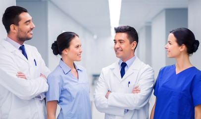 Fototapeta premium happy group of medics or doctors at hospital
