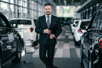 Top sales manager at dealership showroom