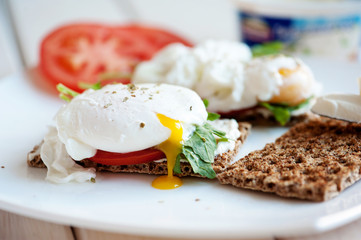 Poached eggs with watercress on toast