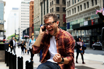 Young man happy on the street of new York