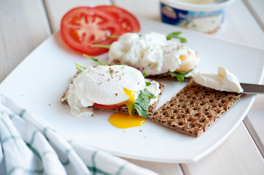 Poached eggs with watercress on toast