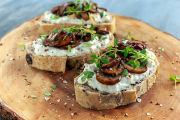 Garlic mushroom toast with creamy herbed ricotta chees spread