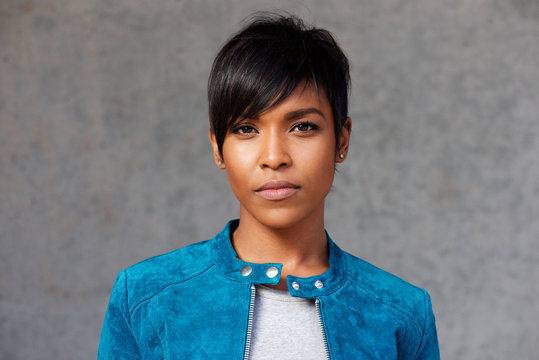 Fototapeta Close up trendy young black woman with blue jacket