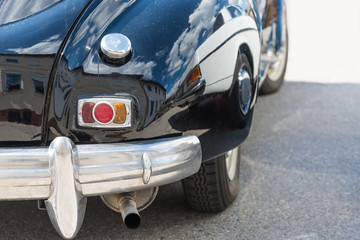 rear right car side of an old french car early 50s - close up - peugeot 203
