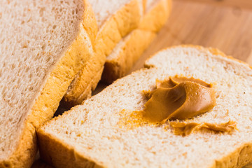 peanut butter and breakfast on wood table