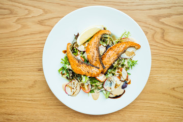 Grilled salmon fillet meat with vegetable salad