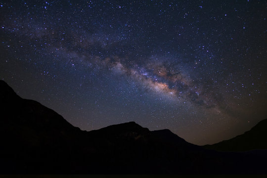 Beautiful milky way  galaxy over moutain on a night sky before sunrise.