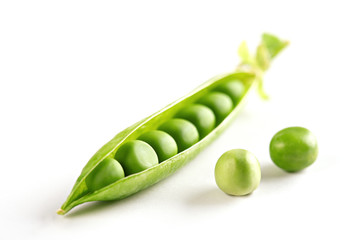 Peas isolated on white. Fresh and raw vegetable macro photo.