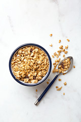 Oatmeal in a bowl. Fresh and healthy breakfast cereals with a spoon. Top view