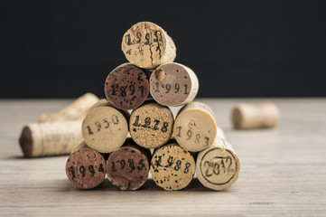 Close up shot of a stack of dated wine bottle corks