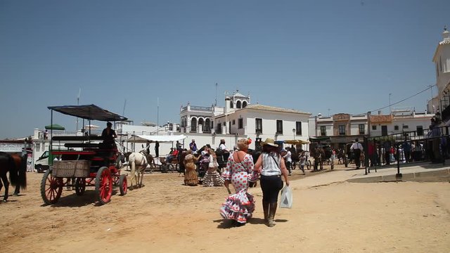 Street scenery in the spanish town El Rocio during the traditional pilgrimage Romeria 2017. Province of Huelva, Almonte, Andalusia, Spain