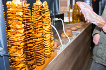 Fried potatos in a row at food festival