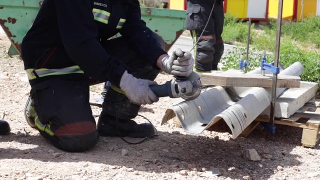 Firefighter practicing with a disc cutter