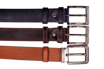 Several fashionable male belts red gray brown isolated on white background